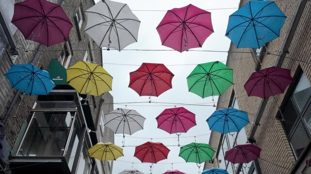 Colorful umbrella hanging at temple bar area Dublin Ireland