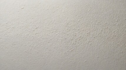 Fototapeta premium Surface Texture of a White Wall With Fine Details Illuminated by Soft Natural Light, Creating a Calming Atmosphere in the Room During the Late Afternoon