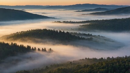 Fototapeta premium Majestic Mountain Landscape at Sunrise With Fog Rolling Through Forests and Valleys in a Serene and Tranquil Setting