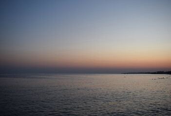 Tranquil Ocean Sunset with Distant Horizon