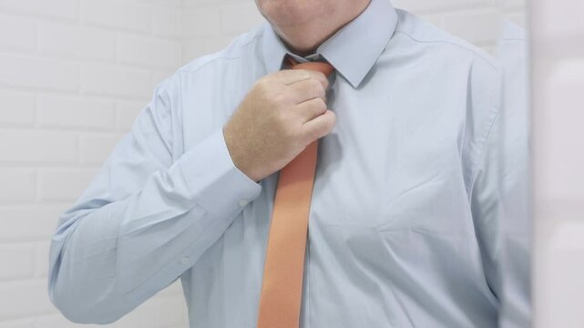 Blurred Shooting with a Businessman in the Mirror Wearing a Blue Shirt and a Neck Tie.