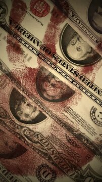 Old Blody Dirty USA dollars banknotes in various age bills set on vertical screen spinning in top close up view loop. Background footage related to money laundering, dirty business, war economics, amo