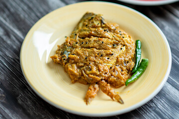 Spicy pabda fish curry gravy.