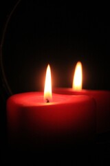 red candle in the dark
