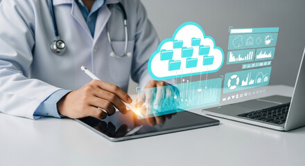 Doctor using tablet with cloud data interface and laptop for medical information management system