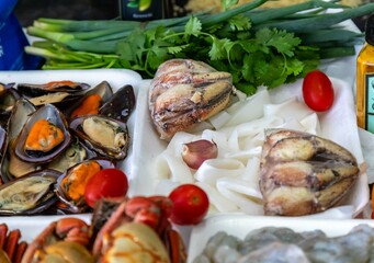 Traditional seafood paella ingredients with a variety of selected seafood. Refined and gourmet cuisine