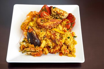 Traditional seafood paella with a variety of selected seafood. Refined and gourmet cuisine