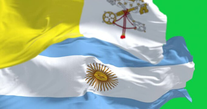 Vatican City and Argentina national flags waving isolated on green background