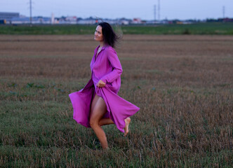 Young Woman's Dance of Freedom in Windy Fields: The Harmony of Femininity and Freedom