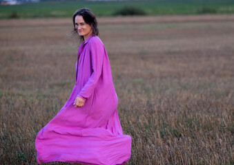Young Woman's Dance of Freedom in Windy Fields: The Harmony of Femininity and Freedom