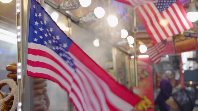American Flag waving at food stand in city 4k