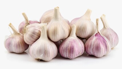 A group of garlic heads with white bulbs and purple veins are densely packed on a white surface. The perfect still life for culinary and healthy recipes.
