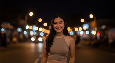 Fototapeta premium Young Woman Smiling with City Lights Bokeh Background at Night (1)