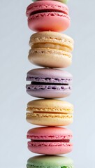 Stacked Pastel Macarons Pink Yellow Purple Green image