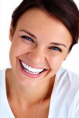 Smiling woman with bright blue eyes and flawless white teeth in casual setting