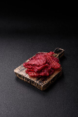 Jerky or dried chicken and cherry snacks. Dehydrated, dried snacks for beer