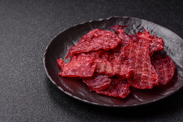 Jerky or dried chicken and cherry snacks. Dehydrated, dried snacks for beer