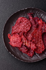 Jerky or dried chicken and cherry snacks. Dehydrated, dried snacks for beer