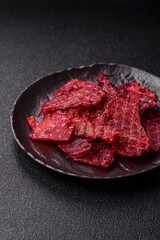 Jerky or dried chicken and cherry snacks. Dehydrated, dried snacks for beer