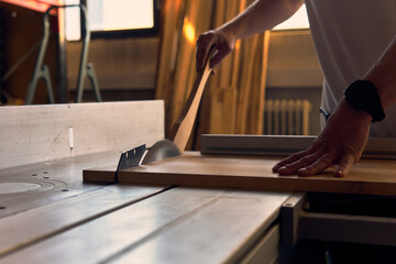 Crafting wood in a workshop located in the Alps, showcasing precision and skill during a woodworking project