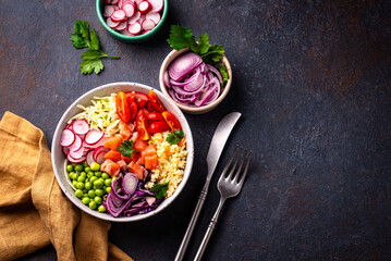 Balanced healthy bowl with vegetables and salmon