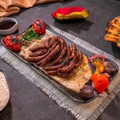 Syrian Sujuk Plate with Tomatoes and Pita Bread