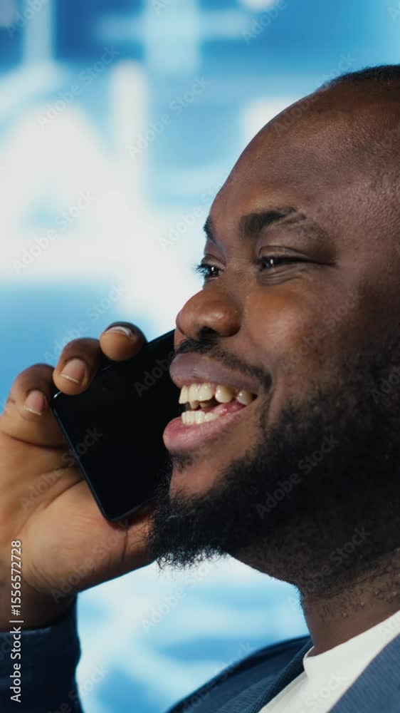 Poster vertical video tech entrepreneur talking on a phone call in an ai environment, representing predicti