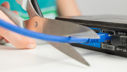 Scissors cut the router cables. 