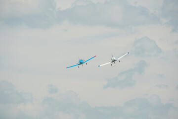 Fototapeta premium joint flight of two light-engine training and sports aircraft as part of an air show
