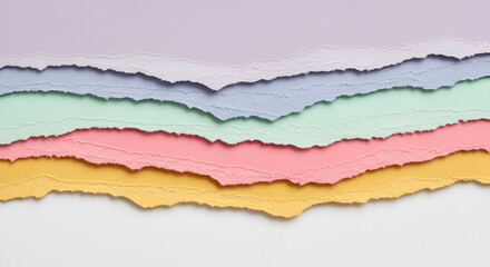 Multicolored pastel paper with torn edges creating a layered abstract design for backgrounds or concepts