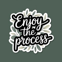 Obraz premium Enjoy the Process—flowy handwritten font with leaves, peaceful natural tones, with thick white sticker-style outline around the design