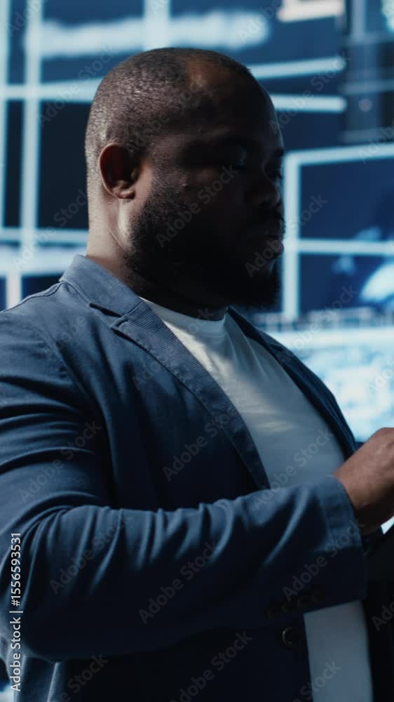 Poster vertical video black male it engineer examining digital ai brain interface on dashboard, symbolizing
