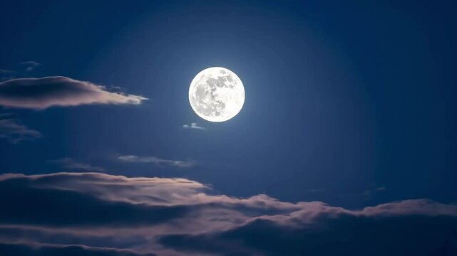 Glowing full moon with clouds at night. Mystical sky landscape.