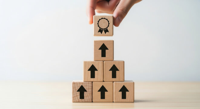 Achievement success award quality wooden blocks hand placing top block growth business goal concept