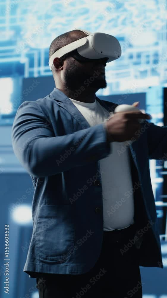 Poster vertical video young african american engineer focused on vr headset programming and analytics, surr