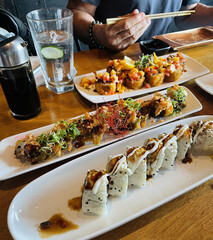 Colorful rolls topped with roasted veggies and edible flowers