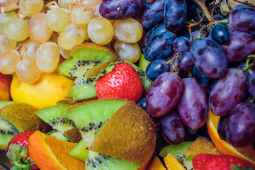 An Elegant and Colorful Fruit Platter Featuring a Variety of Exquisite Exotic Fruits