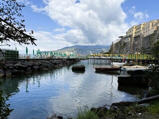 Scenic Harbor with Cliffs and Summer Cabanas