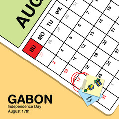 Gabon Independence Day reminder on August 17th in a wall calendar with illustrative people wearing the nation's traditional attire.