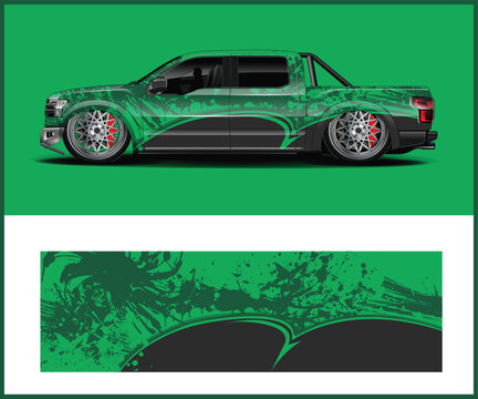 Customized Green Pickup Truck with Splash Graphics and Low Suspension Design