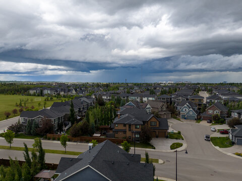 Thunderstorms rolling over suburban Calgary delivering rain and hail.