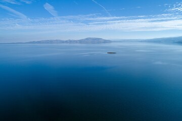 Aerial view of San Luis Reservoir, Santa Nella, California, USA, showing low water levels and...
