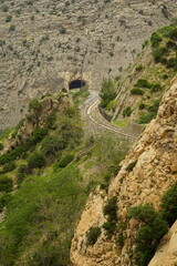 The famous El Caminito del Rey in Malaga with its amazing views with trees, mountains, river and a valley.
