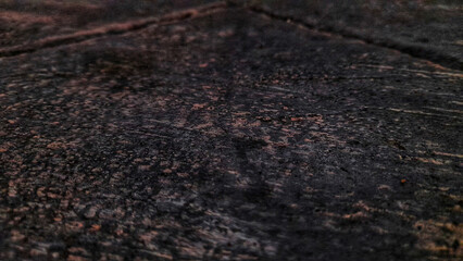 Rough black and red carpet texture, like old granite rock, forms a natural ground pattern