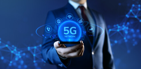 Businessman Holding Smartphone with 5G Network Icons on Screen. Business and Technology concept