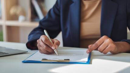 Executive review of contract with pen in hand at a clean modern office desk