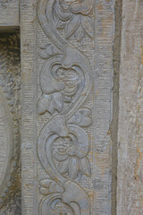 Vintage ornament on the stone. Close-up seamless texture. Stone texture. Embossed pattern.