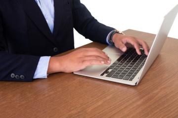 businessman typing on laptop