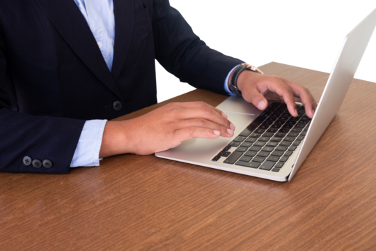 businessman typing on laptop