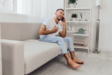 Happy man talking on the phone, embracing vulnerability and emotional connection while sitting...